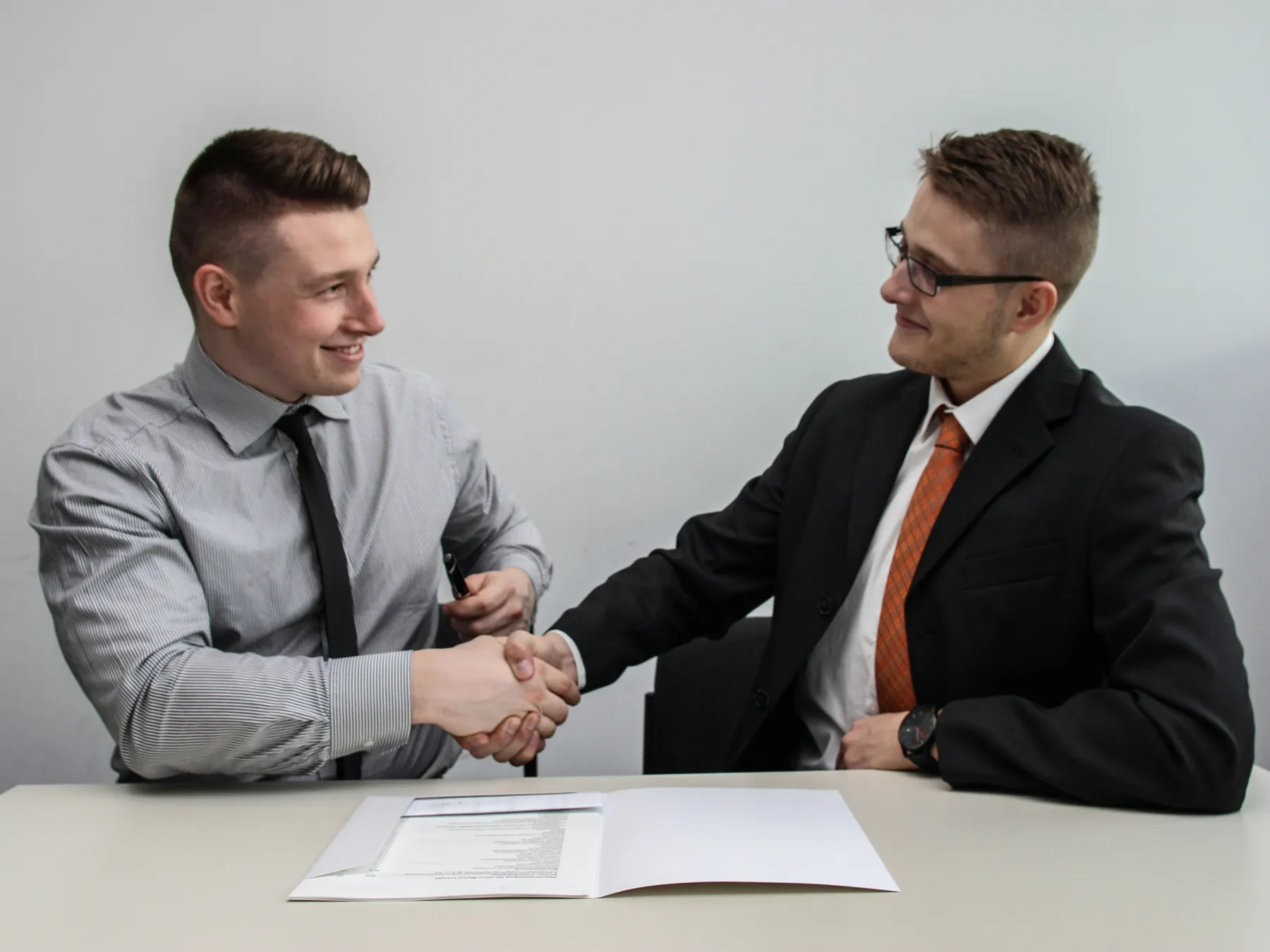 Attorney and client shaking hands after a consultation